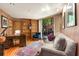 Home office with hardwood floors, built-in shelving, and a comfortable seating area at 6525 Old Riverside Nw Dr, Sandy Springs, GA 30328
