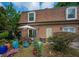 Cozy backyard featuring a patio with a dining set, potted plants, and a brick exterior at 1261 Lavista Rd # N4, Atlanta, GA 30324