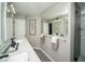 Bright bathroom showcasing a double vanity, large mirror, tiled floors and modern design at 1261 Lavista Rd # N4, Atlanta, GA 30324