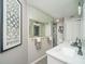 Stylish bathroom featuring a double vanity with marble countertops, large mirror, and tiled floors at 1261 Lavista Rd # N4, Atlanta, GA 30324