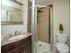 Bathroom with decorative mirror, vanity and a tiled shower at 1261 Lavista Rd # N4, Atlanta, GA 30324