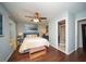 Cozy bedroom with hardwood floors, a comfortable bed, and ensuite bathroom access at 1261 Lavista Rd # N4, Atlanta, GA 30324