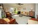 Bright living room featuring a fireplace, hardwood floors, stylish seating, and access to an outdoor patio at 1261 Lavista Rd # N4, Atlanta, GA 30324