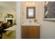 Stylish powder room with modern vanity and decorative mirror at 1261 Lavista Rd # N4, Atlanta, GA 30324
