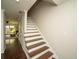 Staircase with carpet runner leading to upper level at 1261 Lavista Rd # N4, Atlanta, GA 30324