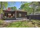 Cozy backyard featuring a pergola, hot tub, and a fire pit area, great for outdoor entertaining at 2049 Oakview Se Rd, Atlanta, GA 30317