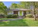 Charming home with cedar shake siding, manicured lawn, and a bright green front door at 2049 Oakview Se Rd, Atlanta, GA 30317
