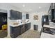Stylish kitchen with dark cabinets, stainless steel appliances, and a modern backsplash at 2049 Oakview Se Rd, Atlanta, GA 30317