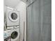 Cozy laundry room featuring stacked washer and dryer to maximize space at 2049 Oakview Se Rd, Atlanta, GA 30317