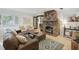Inviting living room with a stone fireplace, stylish furniture, and large windows at 2049 Oakview Se Rd, Atlanta, GA 30317