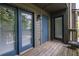 Private balcony featuring wooden flooring and access to exterior storage at 223 Tuxworth Cir, Decatur, GA 30033