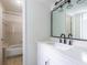 Bathroom featuring modern fixtures, a large mirror, and a tub/shower combo at 223 Tuxworth Cir, Decatur, GA 30033