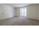 Bright bedroom featuring a window and plush carpet at 223 Tuxworth Cir, Decatur, GA 30033