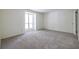 Spacious bedroom with soft carpet and a bright window at 223 Tuxworth Cir, Decatur, GA 30033