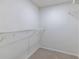 Walk-in closet with carpet flooring and metal racks at 223 Tuxworth Cir, Decatur, GA 30033
