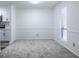 Bright dining area featuring neutral walls, new carpet and large window at 223 Tuxworth Cir, Decatur, GA 30033