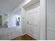 Bright entryway featuring hardwood floors and a modern white door with stylish hardware at 223 Tuxworth Cir, Decatur, GA 30033