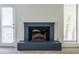 Close-up of brick fireplace that adds character to the well-lit living space at 223 Tuxworth Cir, Decatur, GA 30033