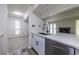 Open concept kitchen with stainless steel dishwasher and granite countertops at 223 Tuxworth Cir, Decatur, GA 30033