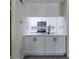 Modern kitchen featuring white cabinets and stainless steel appliances at 223 Tuxworth Cir, Decatur, GA 30033