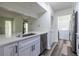 Charming kitchen boasts a stainless steel dishwasher, sink, and white cabinets at 223 Tuxworth Cir, Decatur, GA 30033