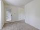 Inviting living room featuring plush gray carpet, and access to the outside patio at 223 Tuxworth Cir, Decatur, GA 30033