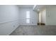 Well-lit living room featuring large window and neutral walls at 223 Tuxworth Cir, Decatur, GA 30033