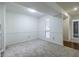 Inviting living room featuring large window and access to a private patio at 223 Tuxworth Cir, Decatur, GA 30033