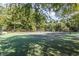 Community tennis court surrounded by mature shade trees at 223 Tuxworth Cir, Decatur, GA 30033