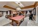 Finished basement with a pool table, wet bar, and seating area is perfect for entertaining at 2973 Misty Rock Cv, Dacula, GA 30019