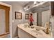 Bathroom featuring dual sinks, a large mirror, and neutral colors provides a functional space at 2973 Misty Rock Cv, Dacula, GA 30019