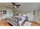 Bedroom boasts wood floors, a ceiling fan, and a cozy atmosphere with natural light at 2973 Misty Rock Cv, Dacula, GA 30019