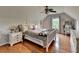 Bedroom boasts wood floors, a ceiling fan, and a cozy atmosphere with natural light at 2973 Misty Rock Cv, Dacula, GA 30019