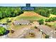 A prestigious golf course community showcasing its elegant club house and perfectly manicured grounds at 2973 Misty Rock Cv, Dacula, GA 30019