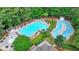 Aerial view of community pool with large pool, pool, and slide at 2973 Misty Rock Cv, Dacula, GA 30019