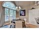 Dining room with large arched window that offers a view of the wooded backyard at 2973 Misty Rock Cv, Dacula, GA 30019