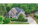 Beautiful two-story brick home featuring a well-manicured lawn and long driveway at 2973 Misty Rock Cv, Dacula, GA 30019