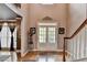 Bright foyer with hardwood floors, double doors, and staircase at 2973 Misty Rock Cv, Dacula, GA 30019