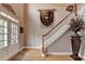 Elegant foyer featuring hardwood floors, a staircase, and decor at 2973 Misty Rock Cv, Dacula, GA 30019