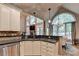 Contemporary kitchen with granite countertops, stainless steel appliances, and backyard view at 2973 Misty Rock Cv, Dacula, GA 30019