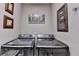 Modern laundry room with front-load washer and dryer, decorated with framed art at 2973 Misty Rock Cv, Dacula, GA 30019