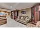 Basement living area featuring a large sofa, pool table, and built-in entertainment center at 2973 Misty Rock Cv, Dacula, GA 30019