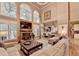 Bright living room featuring a stone fireplace, hardwood floors, and open-concept design at 2973 Misty Rock Cv, Dacula, GA 30019