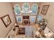 Open-concept living room features a fireplace, soaring ceilings and many windows for natural light at 2973 Misty Rock Cv, Dacula, GA 30019