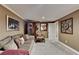 Cozy basement living room with a plush sofa, accent chair, and neutral decor at 2973 Misty Rock Cv, Dacula, GA 30019