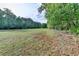 A vast open field offers potential for various outdoor activities and beautiful natural surroundings at 2973 Misty Rock Cv, Dacula, GA 30019