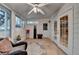 Bright sunroom with tile floors, multiple windows, and a door to the outside at 2973 Misty Rock Cv, Dacula, GA 30019