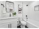 Elegant bathroom featuring marble countertops, tub-shower combination, and stylish fixtures at 4327 Wellington Hills Ln, Snellville, GA 30039