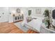 Bright bedroom featuring a hardwood floor, neutral color scheme, and stylish furniture at 4327 Wellington Hills Ln, Snellville, GA 30039