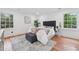 Bright bedroom featuring hardwood floors, neutral color scheme, and ample natural light at 4327 Wellington Hills Ln, Snellville, GA 30039